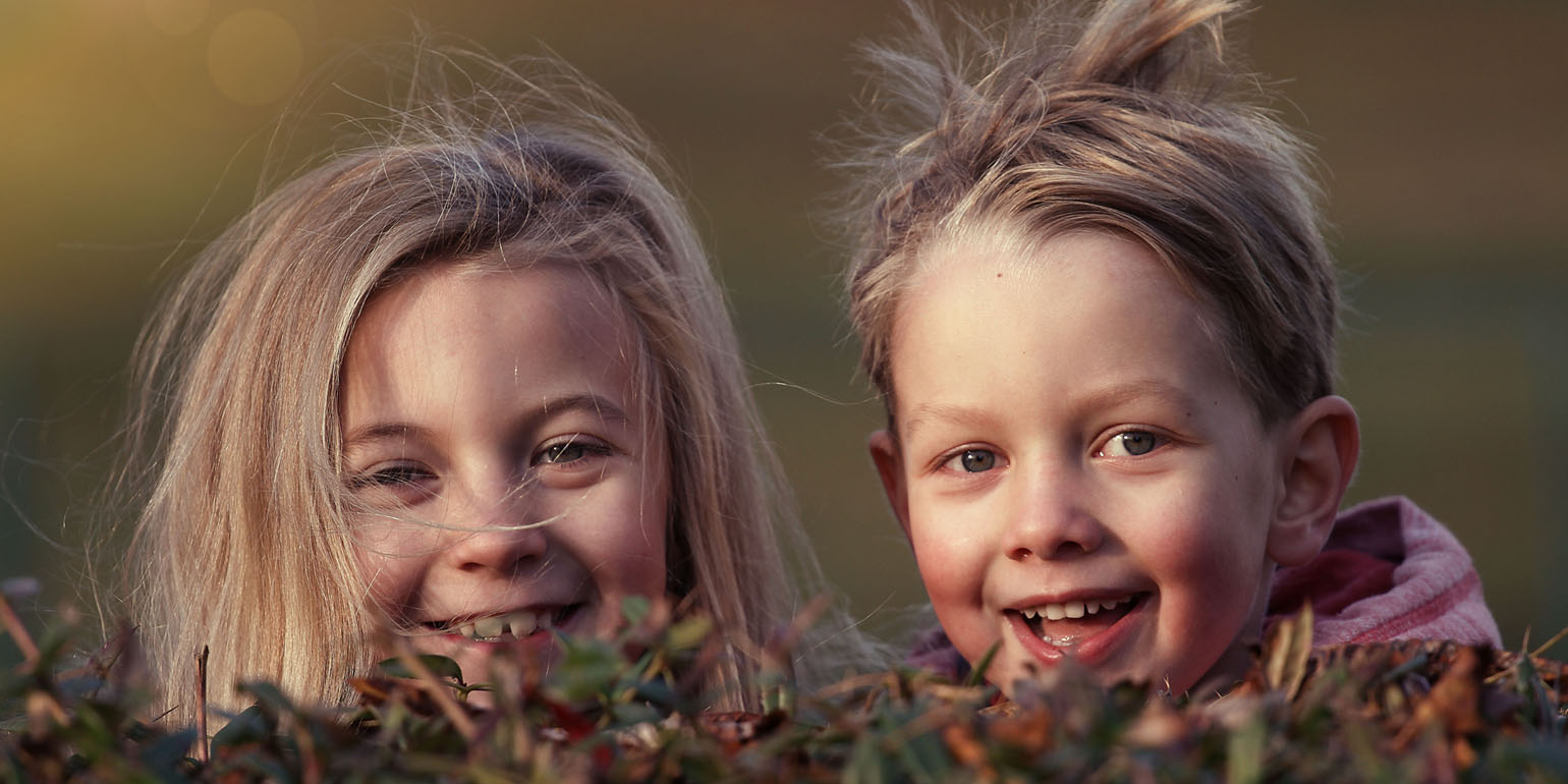 Two kids laughing.