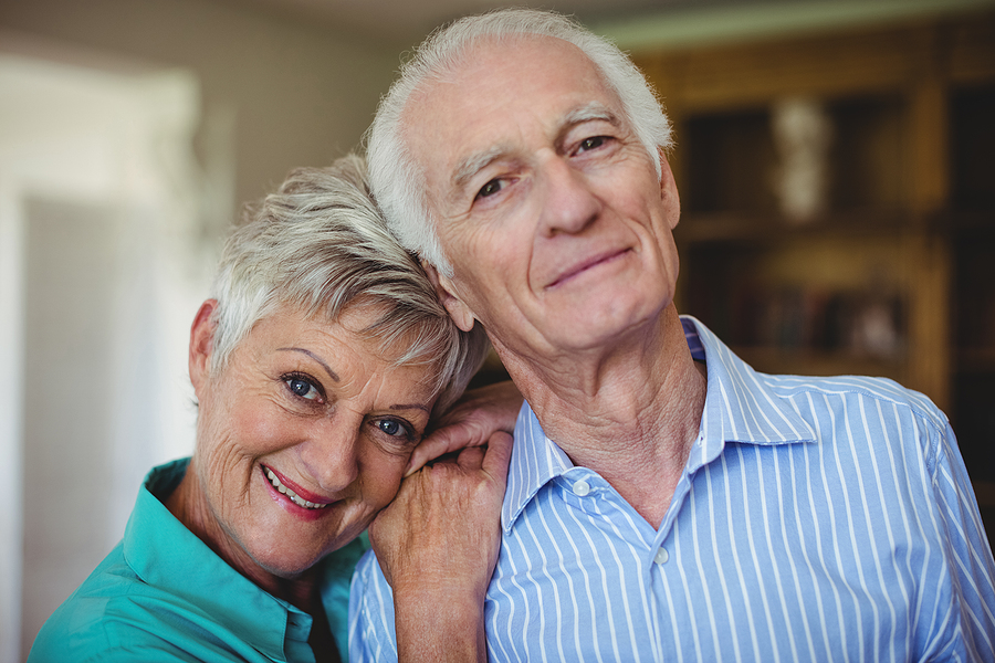 A smiling white senior couple.